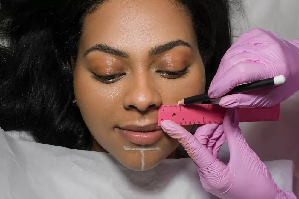 Woman Receiving Restylane Lyft Injection For Smile Line Correction