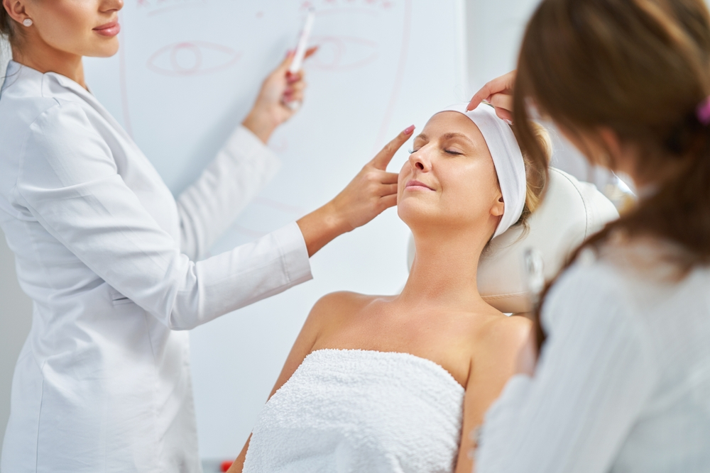 Doctor Pointing Female Patient Face