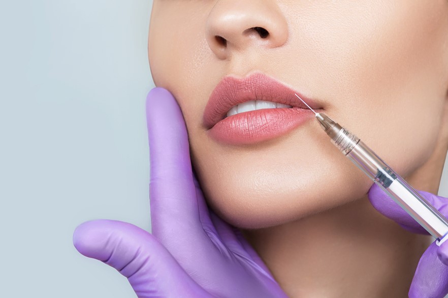 Injecting Restylane Silk In Female Patient Lips