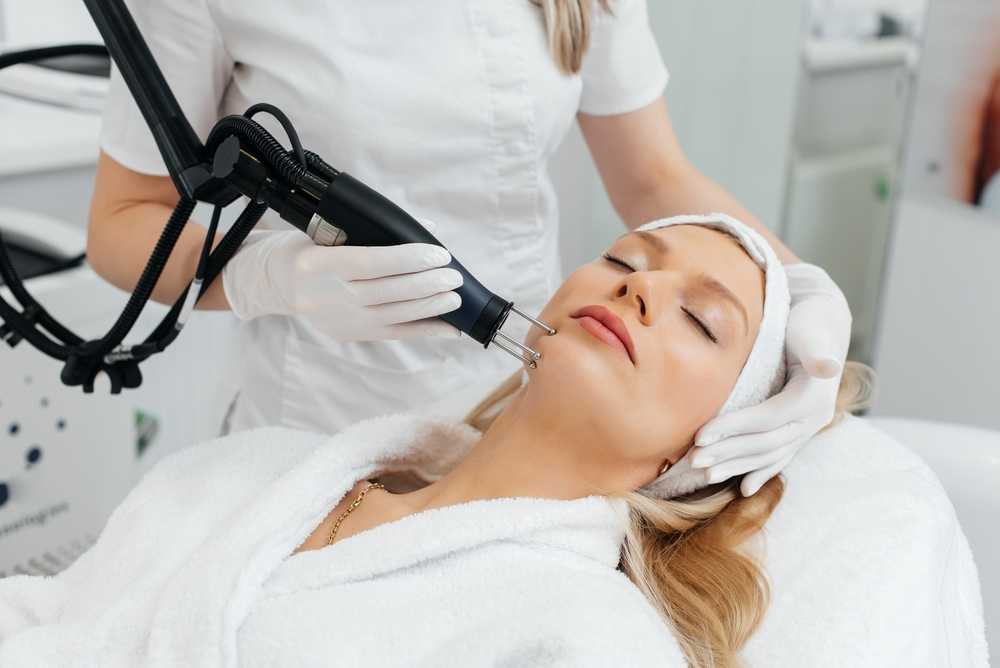 Woman Eyes Closed Receiving Radiofrequency Treatment On Face