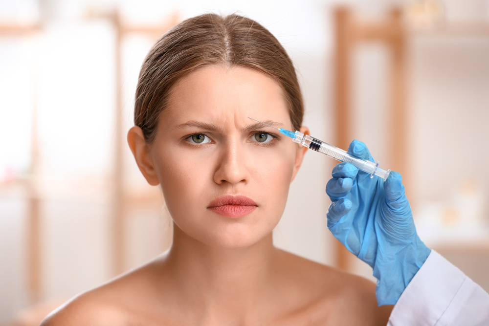 Woman Frowning Receiving Dysport Injection