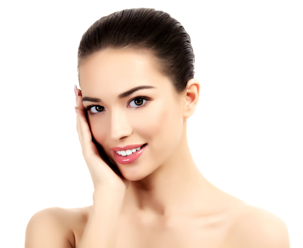 Radiant woman smiling with smooth skin after TMJ Botox treatment, exemplifying successful recovery and aftercare results