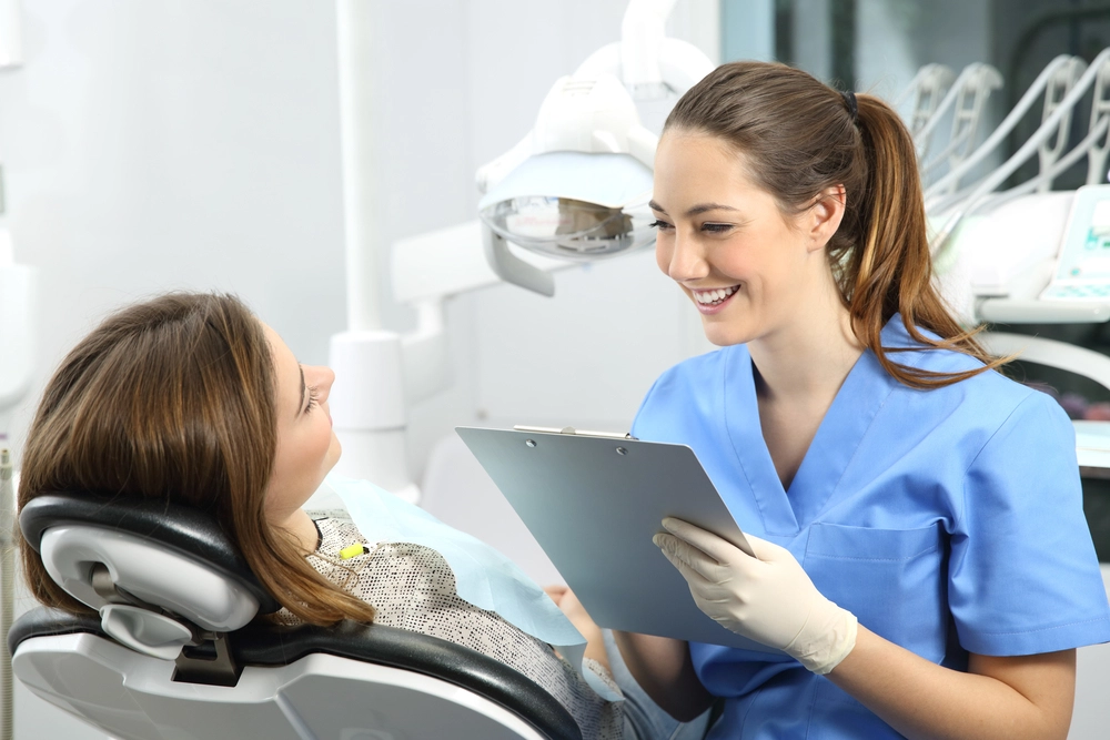 cosmetologist professional discussing with a patient about Jeuveau treatment.