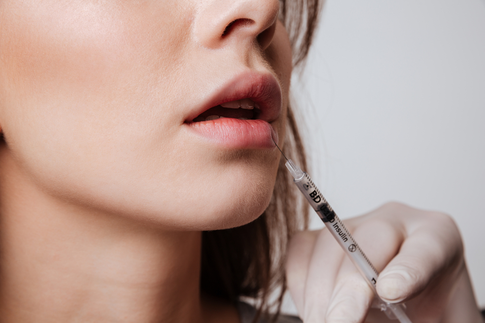 Young Woman Make Versa Lip Injection
