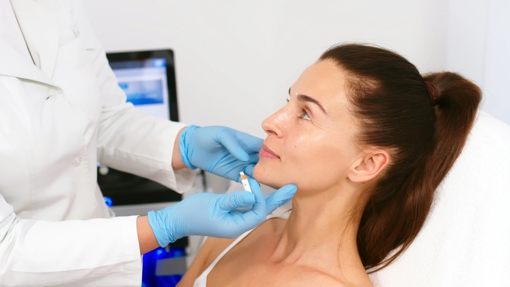Patient Receiving Restylane Eyelight Treatment Preparation At Cosmetic Injectables