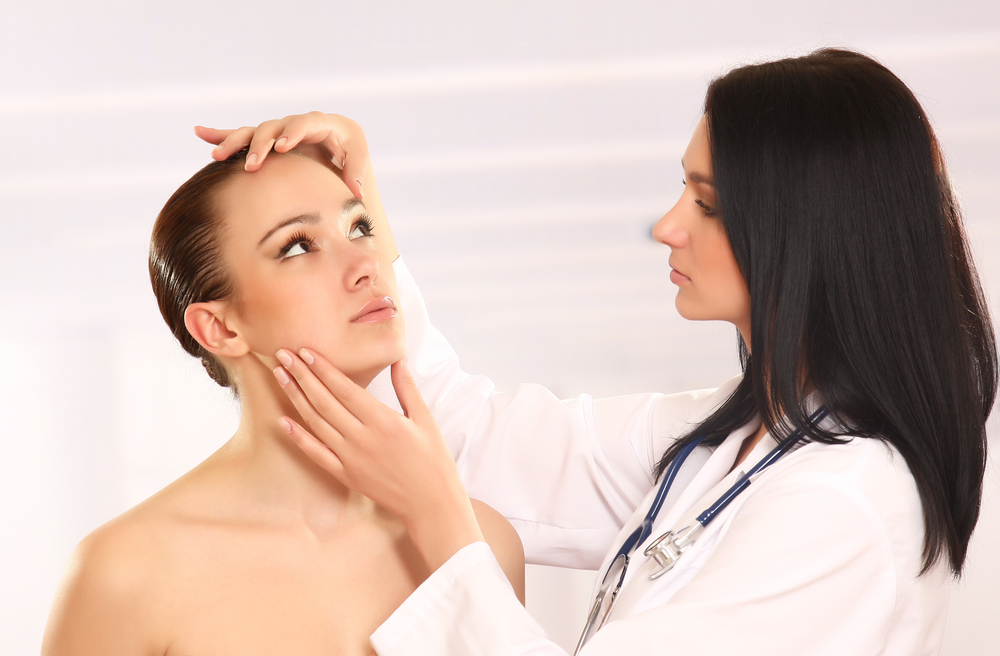 Cosmetologist Evaluating Patient For Side Effects After Rha 1 Treatment