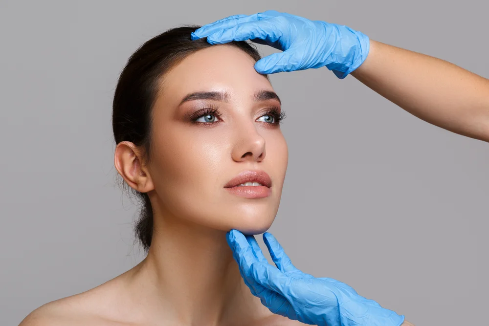 Preparing For Lip Filler Treatment With A Detailed Facial Assessment By A Cosmetic Specialist
