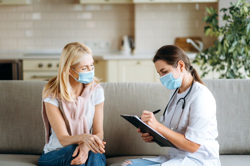 Patient consulting with a doctor before receiving Botox treatment for migraines.