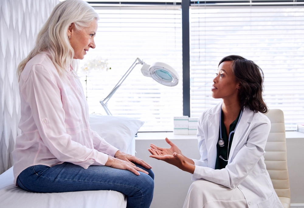 Doctor consulting patient about candidacy for cosmetic procedure.